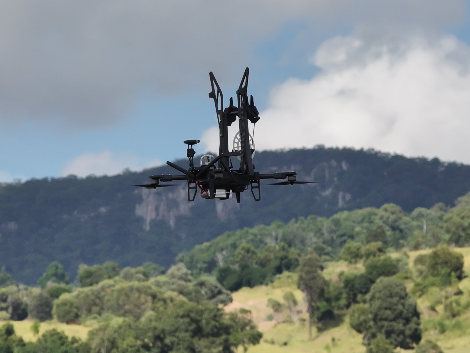 AeroClip S in flight below an escarpment